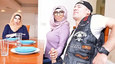 Hijab-wearing damsel providing a hand-job from under the table