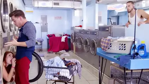 Sandy-haired is providing a blow-job at the laundromat