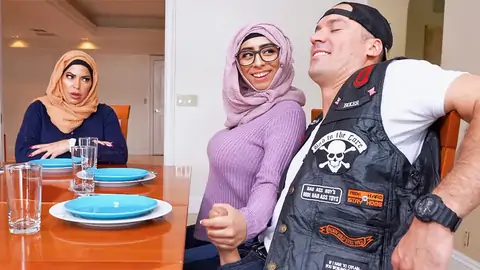 Hijab-wearing damsel giving a arm-job from under the table